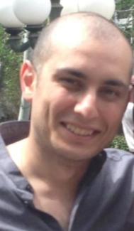 Gentleman smiling at camera.